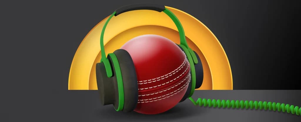 A red cricket ball wearing large green and black headphones with a coiled green audio cable, against a dark background with a yellow arch shape behind it. 