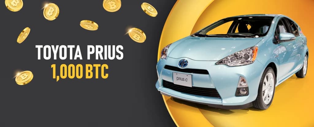 A light blue Toyota Prius C is displayed on a yellow background, surrounded by floating gold Bitcoin coins. Bold white and yellow text on the left reads “TOYOTA PRIUS – 1,000 BTC.”