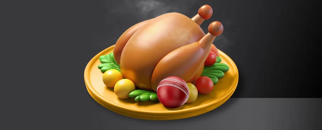 A roasted bird meat features alongside a red cricket ball on a plate. On a black background.