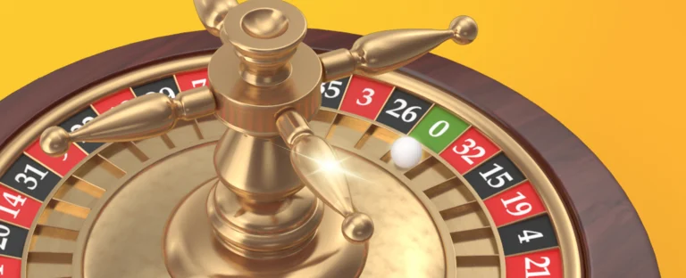 : A roulette wheel with the ball placed on the ‘0’ slot features. On a yellow background.