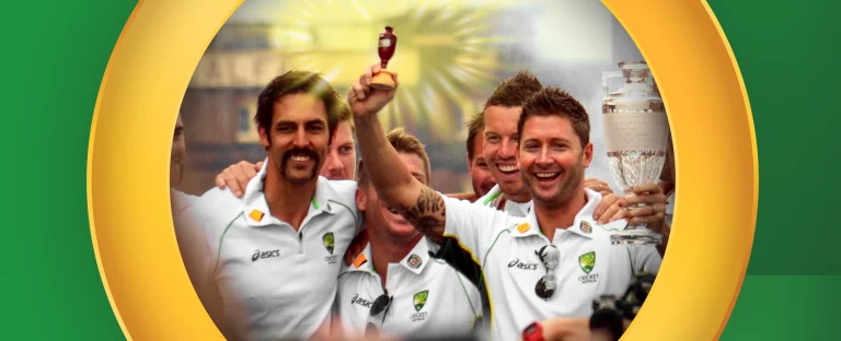 Australian cricket players celebrate a victory, smiling and holding up the Ashes urn and trophy, framed by a gold oval on a bright green background.