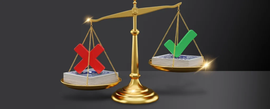 A golden balance scale compares two stacks of playing cards. The left side has a red X and is lower, while the right side has a green checkmark and is higher on a dark background.